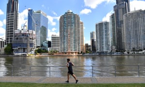 A man jogs beside the Brisbane River at Kangaroo Point in Brisbane