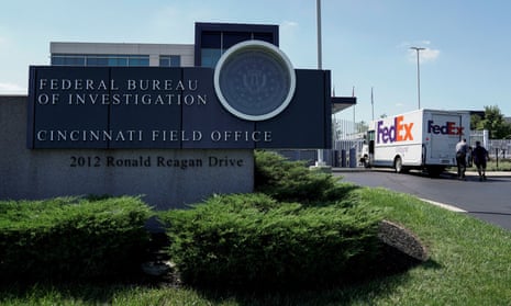 A FedEx truck is inspected outside of the front gate of the FBI's Cincinnati field office.