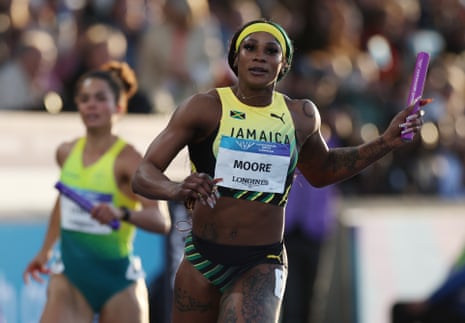 Moore ocrosses the finish line for gold.