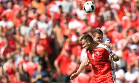 Switzerland’s forward Haris Seferovic, left, goes up for a header with Poland’s defender Artur Jedrzejczyk.