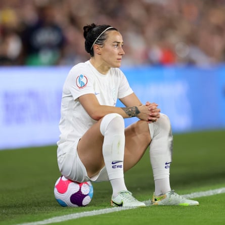 Lucy Bronze of England looks on.
