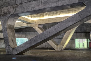 Zaha Hadid. Completed 2014For all its spectacle, the DDP carries cultural weight. It occupies the site of a former Japanese military facility and sits beside excavated relics from the Joseon dynasty. Like Korea itself, the DDP is built on the past but refuses to be defined by it. It vaults forwards, concrete lungs beneath a polished skin, brutal in ambition and execution