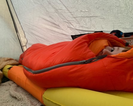 Matt Collins’s six-year-old in their sleeping bag in a tent while camping at Holden Farm, Hampshire.