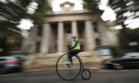A woman on a penny farthing