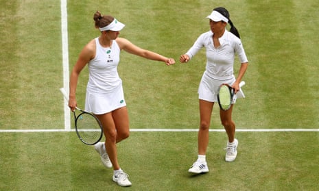 Elise Mertens and Su-Wei Hsieh during their doubles semi-final match at Wimbledon