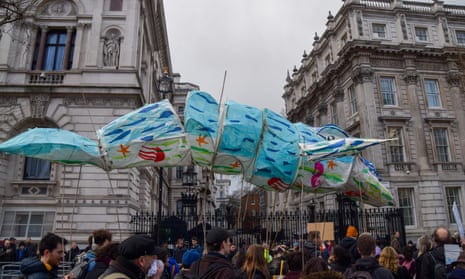 Climate activists calling on the government to stop the Rosebank oil and gas field hold a paper whale at a demonstration outside Downing Street on 15 January, 2023.