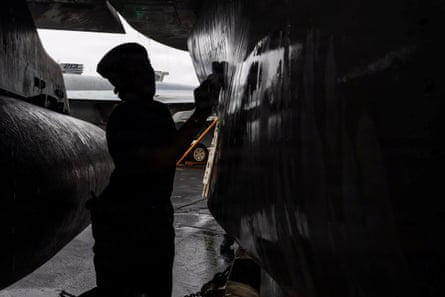 a man cleaning a ship