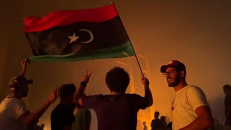Libyan protesters storm and set fire to parliament building in Tobruk – video