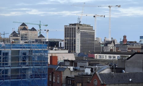General view of the city centre skyline showing construction cranes and commercial buildings