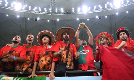 Fans of Morocco, the Atlas Lions, show their support at Al Thumama Stadium.