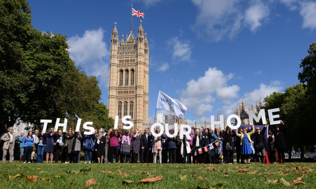 EU citizens holding up a banner saying 'This Is Our Home' after lobbying MPs to guarantee their post-Brexit rights at the Houses of Parliament in London, January 2019