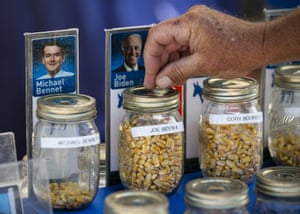 An attendee casts a corn kernel supporting former U.S. Vice President Joe Biden, 2020 Democratic presidential candidate, in a straw poll during the Iowa State Fair.