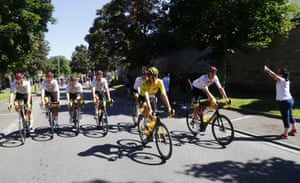 Slovenian rider Tadej Pogacar of UAE-Team Emirates is flanked by teammates en route to Paris.