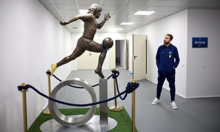 The England manager, Gareth Southgate, admires a statue of Diego Maradona in Naples.