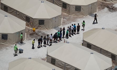 Children and workers at a tent encampment housing migrant children in Tornillo, Texas, on 19 June.