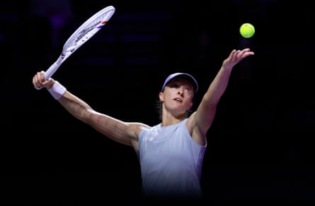 Iga Swiatek serves in Riyadh