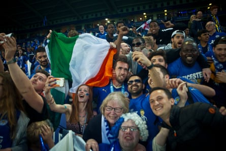 Christian Fuchs celebrates with Leicester fans as they celebrate winning the Premier League