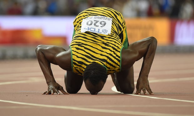 Usain Bolt celebrates his victory in the 200m which saw him complete the sprint double at the world championships.