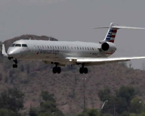 An American Eagle jet flies through heat ripples as it lands at Sky Harbor International Airport in Phoenix