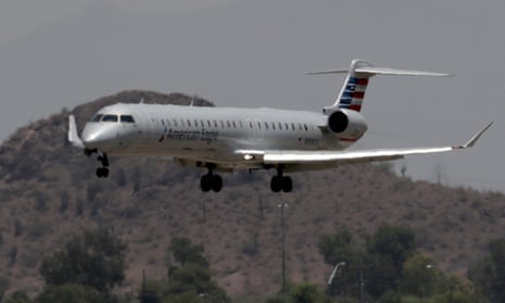 An American Eagle jet flies through heat ripples as it lands at Sky Harbor International Airport in Phoenix