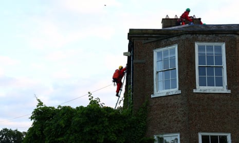 Greenpeace activists climbing on to the roof.
