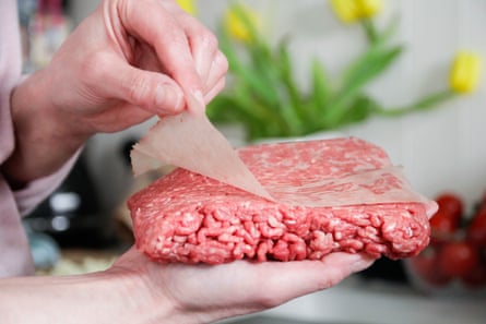 Chunk of mince with the plastic being peeled off