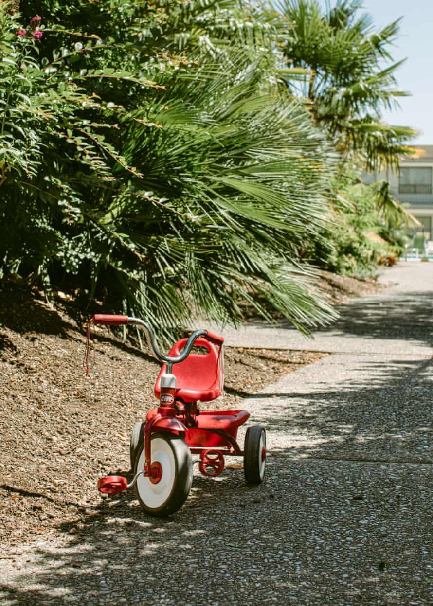 A tricycle sits outside hotel