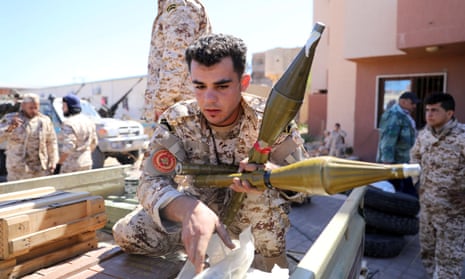 Members of Misrata forces, which have reinforced Tripoli’s forces, prepare themselves to go to the front line.