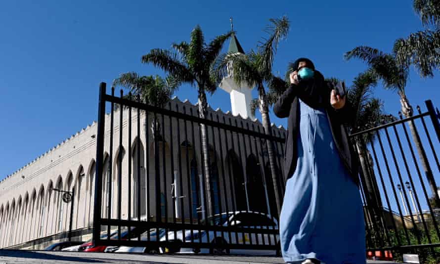 A woman waits for her Covid vaccination in front of Lakemba mosque's outside a pop-up vaccination clinic in Sydney in August 2021.