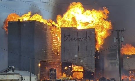 A grain elevator burns in Denton, Montana, on 1 December. In some places the unusually warm temperatures have helped spur abnormally late wildfires, with flames roaring across the prairies of Montana. 