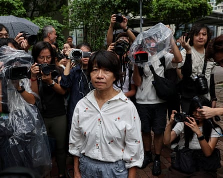 Elizabeth Tang Yin-ngor looks at the camera, surrounded by others