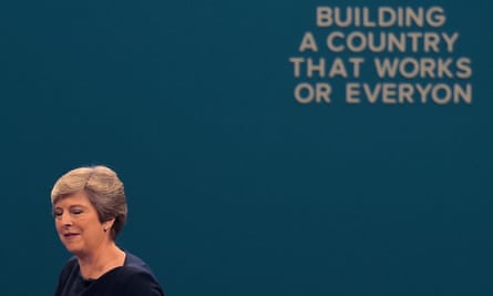 Theresa May passing a slogan whose letters have fallen off, after delivering her speech on the final day of the Conservative party annual conference in 2017.