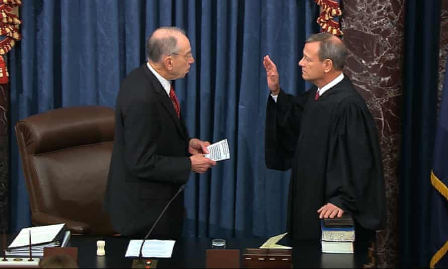 Senator Chuck Grassley swears in Supreme Court Chief Justice John Roberts as the presiding officer for the impeachment trial.