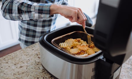 Man Cooks Waffle Fries in Air Fryer