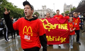 Demonstrators protest in London over working conditions and zero-hour contracts at McDonald’s.