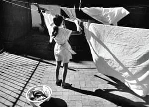 Pilar Aymerich, 1972Housekeeper in the Eixample courtyard, Barcelona, 1972Pilar Aymerich was born in Barcelona and after working abroad for years returned to the city to work professionally, contributing to publications such as Serra d’Or, Destino, Triufo, la Calle and El Pais. Most of her work is published in black and white as a connection to classical jounalism. In 2018, the Reina Sofia National Art Museum acquired part of her back catalogue. In 2021, she won the National Photography Award.