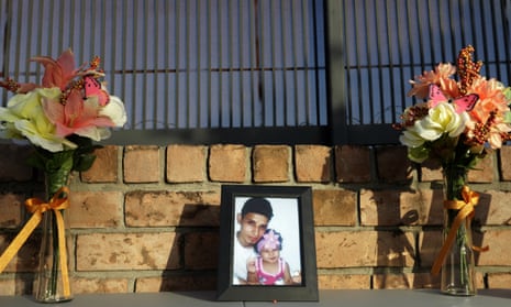 A framed photo of Óscar Alberto Martínez Ramírez and his daughter, Angie Valeria, sits on an altar with flowers during a candlelight vigil in Brownsville, Texas, on 30 June.