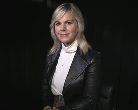 Woman in white turtleneck and black blazer