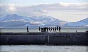 BRITAIN-CAMERON-SUBMARINE<br>British Navy personnel stand atop the Trident Nuclear Submarine, HMS Victorious, on patrol off the west coast of Scotland on April 4, 2013 before the visit of British Prime Minister David Cameron. AFP PHOTO/ANDY BUCHANAN        (Photo credit should read Andy Buchanan/AFP/Getty Images)
