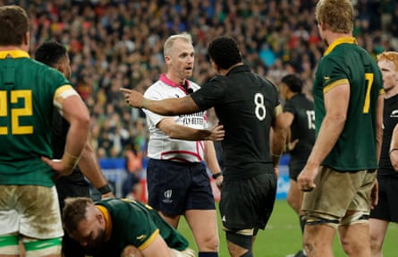 Referee Wayne Barnes of England talks to the New Zealand stand-in captain Ardie Savea after a scrum collapses versus South Africa.
