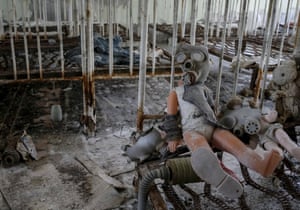 A doll in a children’s gas mask is photographed at a kindergarten in the abandoned city near the Chernobyl nuclear power plant