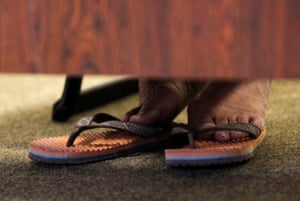 The feet of Tibetan spiritual leader the Dalai Lama at a news conference in Tokyo in 2011.
