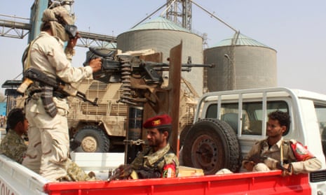 Soldiers with a military coalition in Yemen backed by Saudi Arabia and the UAE stand guard at a grain facility in Hodeida on 22 January 2019.