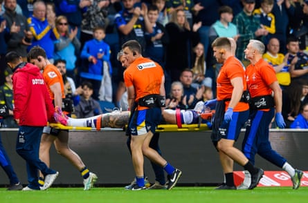 Wakefield’s Cameron Scott is taken off on a stretcher after being knocked out in a clash with Leeds’ Keenan Palasia.