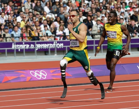 South Africa’s Oscar Pistorius, left, and Jamaica’s Rusheen McDonald compete in a men’s 400-meter heat during the athletics in the Olympic Stadium at the 2012 Summer Olympics, London, Saturday, Aug. 4, 2012