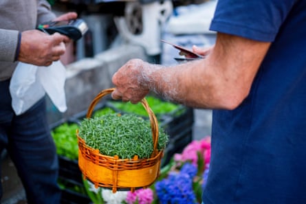 A man buying sprouting greens in Tehran as Iranians prepare for the Persian New Year, or Nowruz, earlier this year.