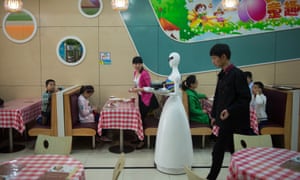 Can be frustratingly slow … a robot waiter makes her rounds in Kunshan in 2016.