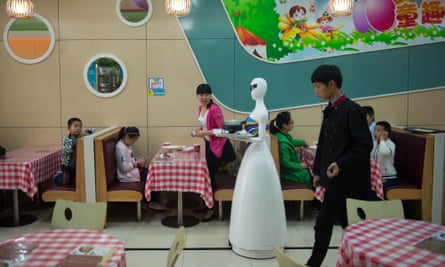 Can be frustratingly slow … a robot waiter makes her rounds in Kunshan in 2016.