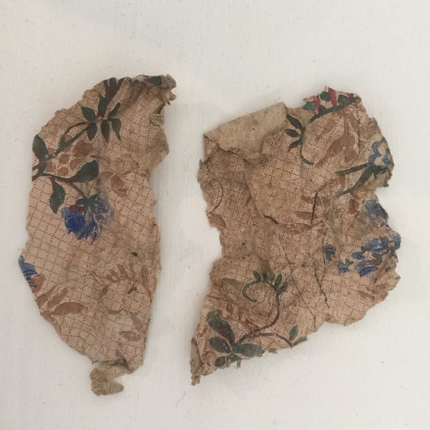 Fragments of squared paper with watercolour flowers