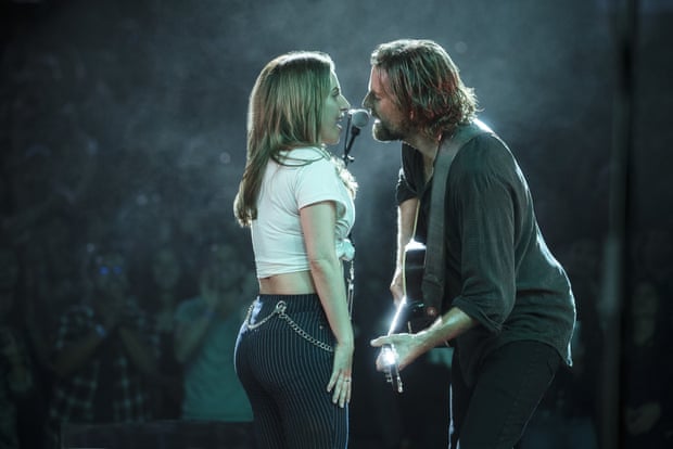 Bradley Cooper and Lady Gaga sing on stage in A Star Is Born